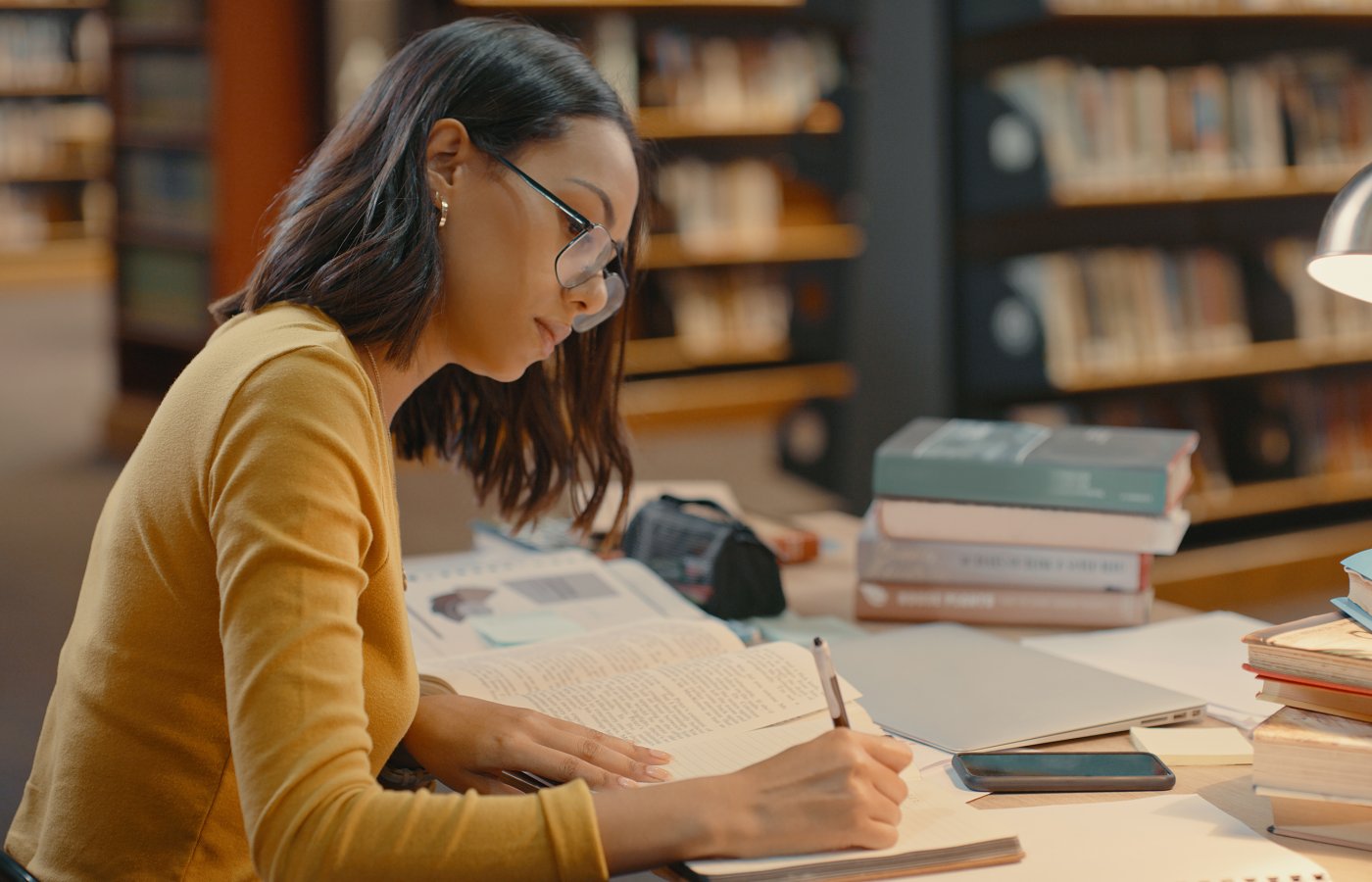 Woman studying in a library