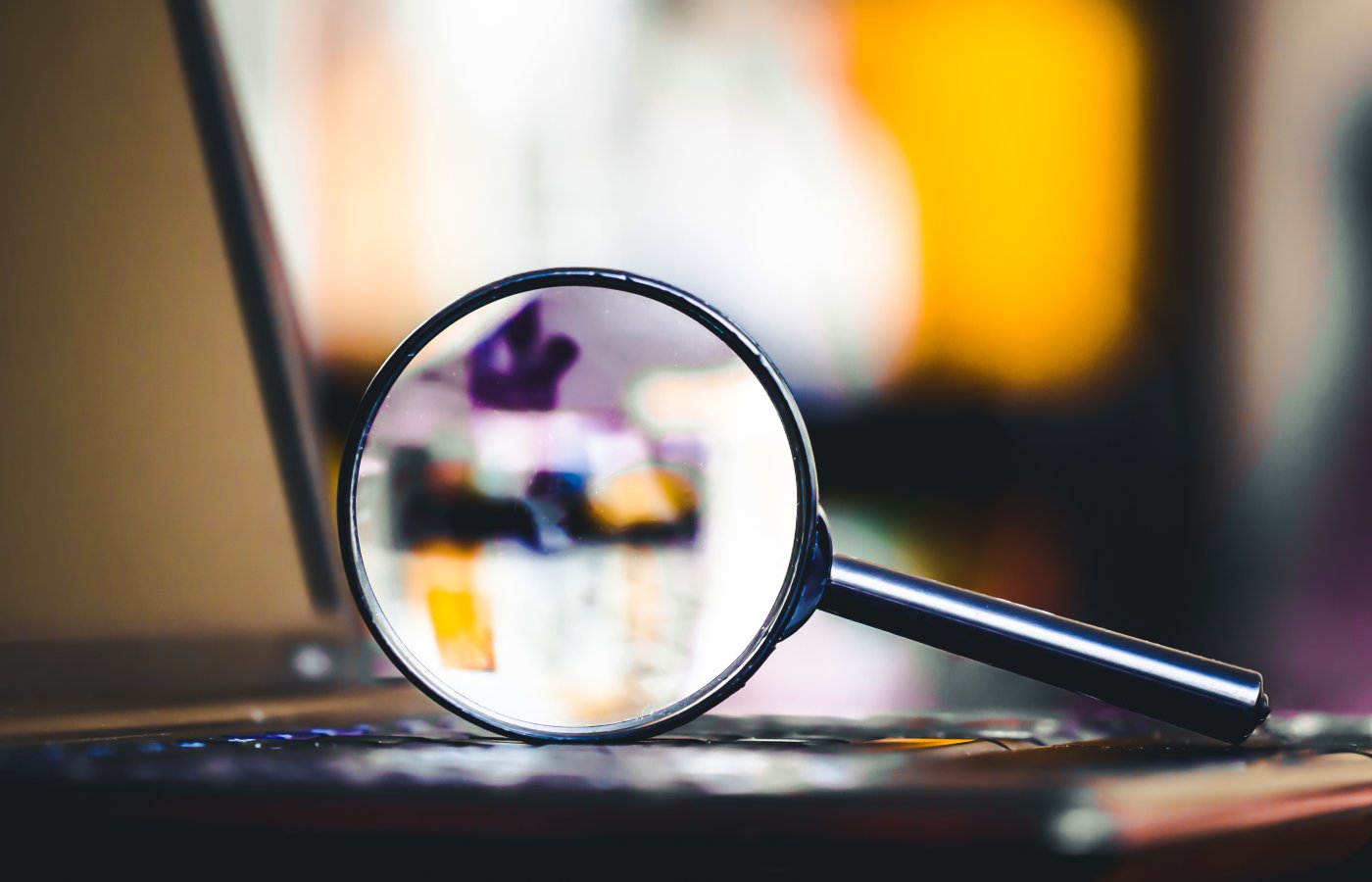 magnifying glass on computer keyboard