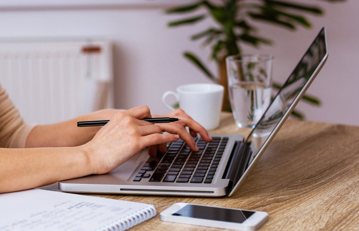 person typing on laptop 