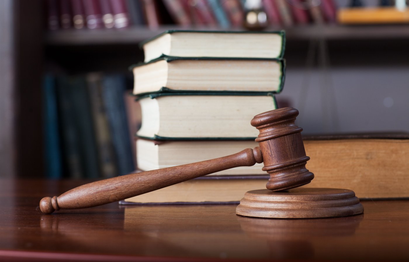 Gavel with stack of books in background
