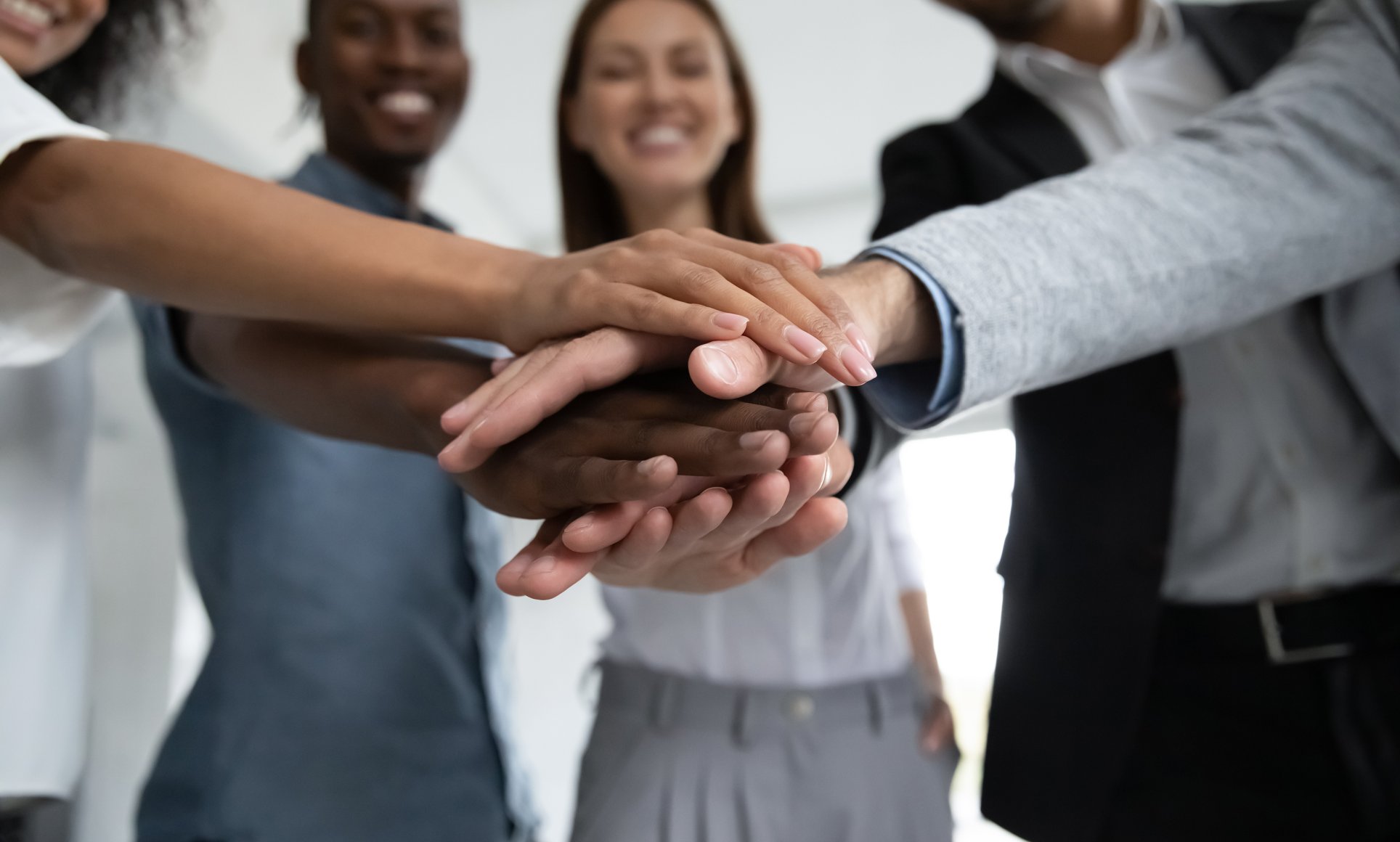 diverse group of people with hands together